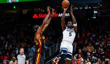 Minnesota Timberwolves guard Anthony Edwards (5) shoots over Atlanta Hawks guard Nickeil Alexander-Walker during the first half of an NBA basketball game, Wednesday, Dec. 31, 2025, in Atlanta. (AP Photo/Colin Hubbard)