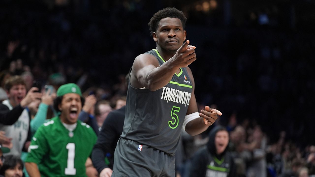 Minnesota Timberwolves guard Anthony Edwards (5) reacts after making a basket during the second half of an NBA basketball game against the San Antonio Spurs, Sunday, Jan. 11, 2026, in Minneapolis. (AP Photo/Abbie Parr)