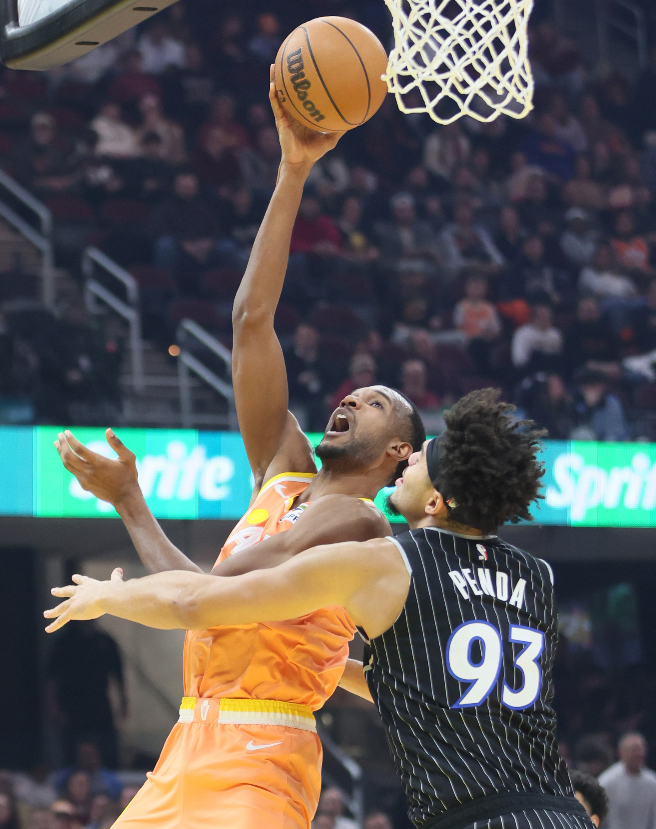 Cleveland Cavaliers center Evan Mobley drives to the basket for a score guarded by Orlando Magic forward Noah Penda in the first half at Rocket Arena. 
