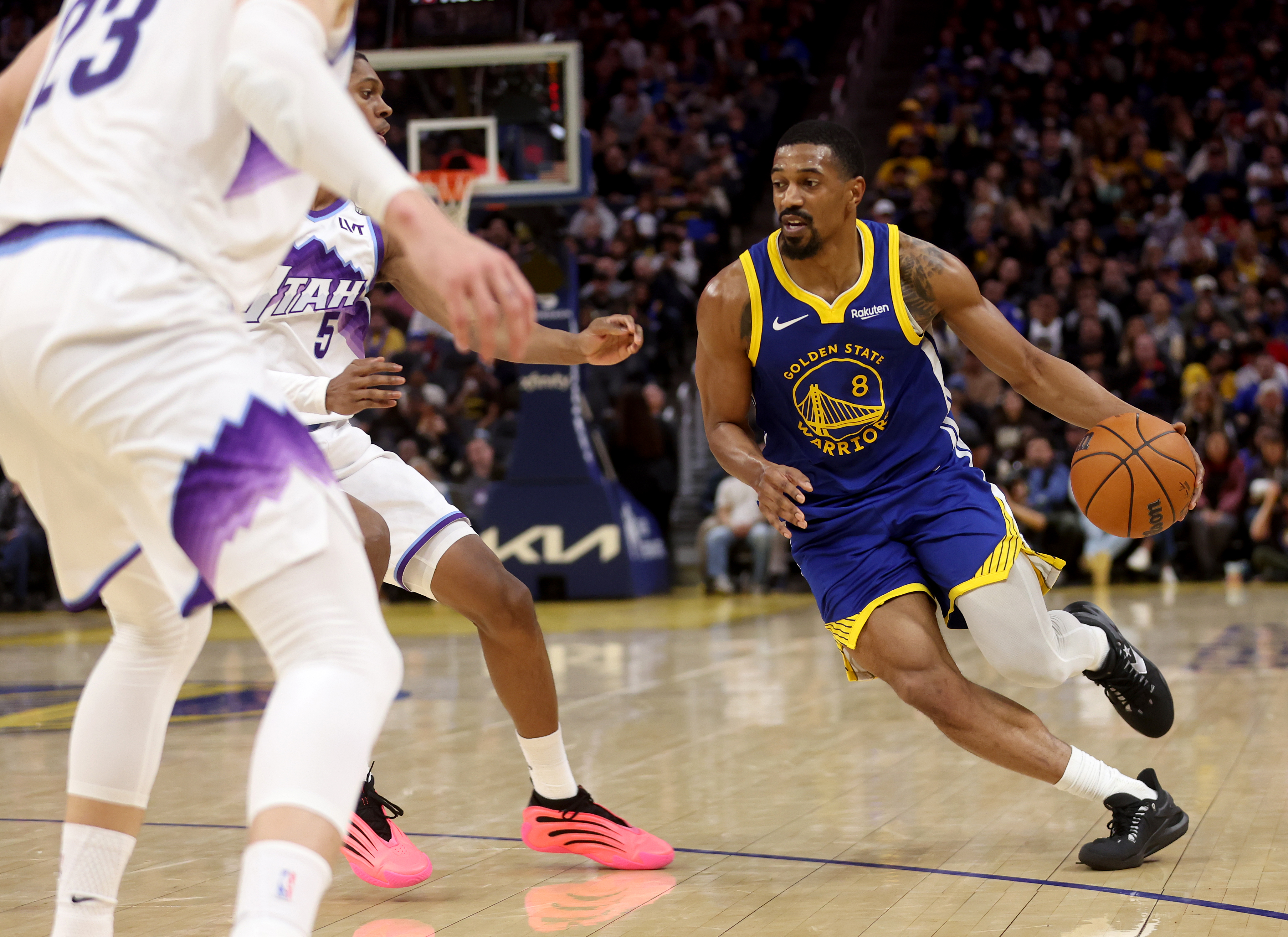 Golden State Warriors’ De’anthony Melton #8 is guarded by Utah...