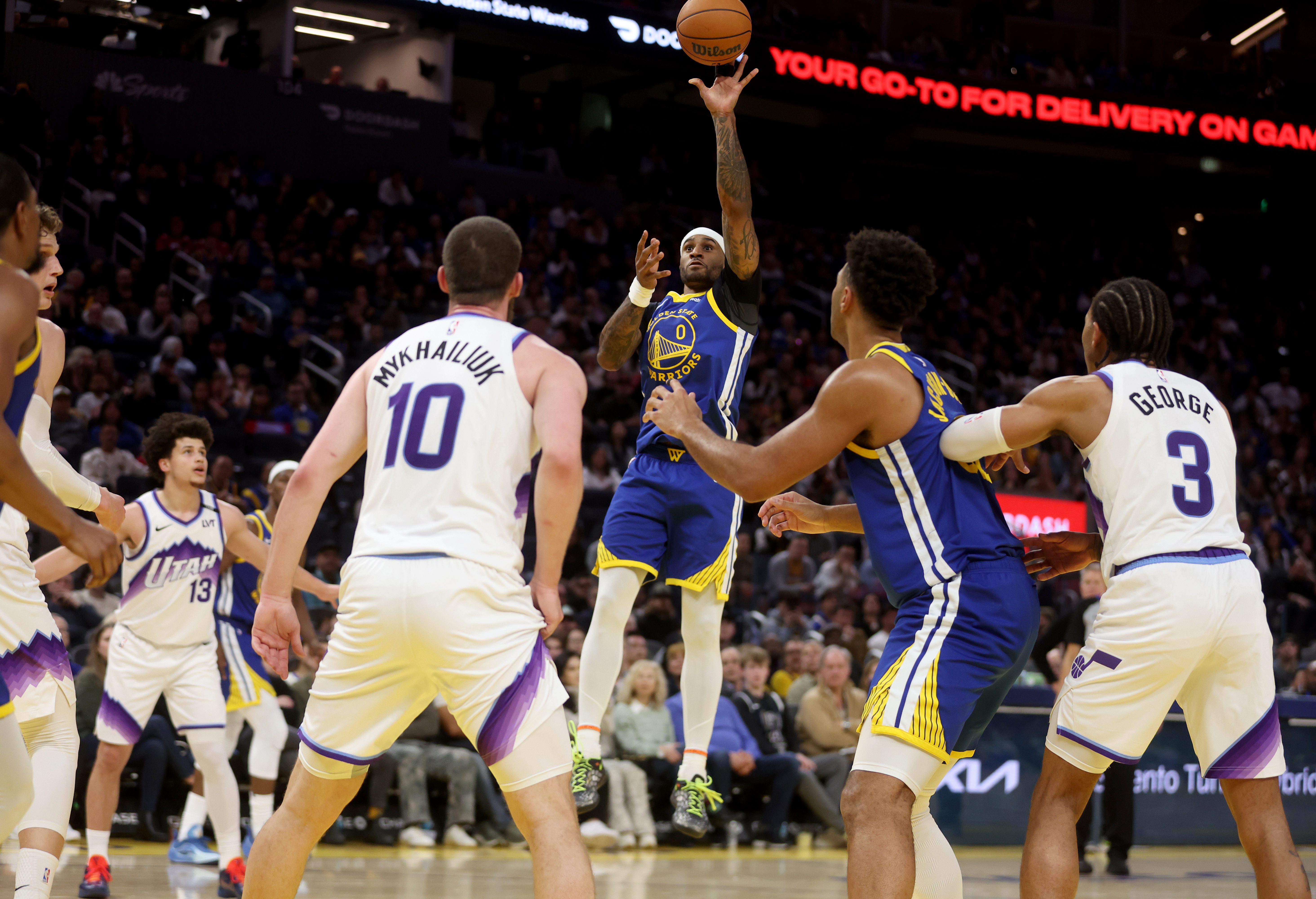 Golden State Warriors’ Gary Payton II #0 takes a shot...