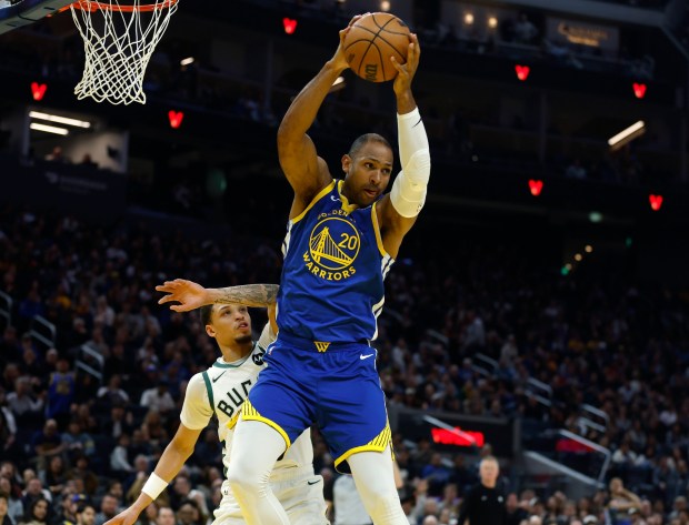 Golden State Warriors' Al Horford (20) grabs an offensive rebound against the Milwaukee Bucks in the second quarter at the Chase Center in San Francisco, Calif., on Wednesday, Jan. 7, 2026. (Nhat V. Meyer/Bay Area News Group)