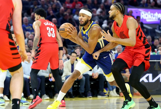 Golden State Warriors' Moses Moody (4) looks to pass against the Portland Trail Blazers' Rayan Rupert (21) in the second quarter of an NBA game at Chase Center in San Francisco, Calif., on Tuesday, Jan. 13, 2026. (Ray Chavez/Bay Area News Group)