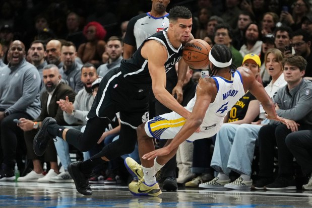 Brooklyn Nets' Michael Porter Jr. (17) collides with Golden State Warriors' Moses Moody (4) during the first half of an NBA basketball game Monday, Dec. 29, 2025, in New York. (AP Photo/Frank Franklin II)