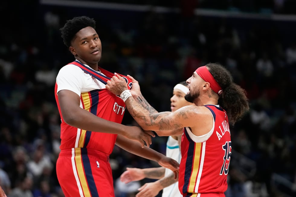 New Orleans Pelicans guard Jose Alvarado (15) celebrates after center Derik Queen, left, was...