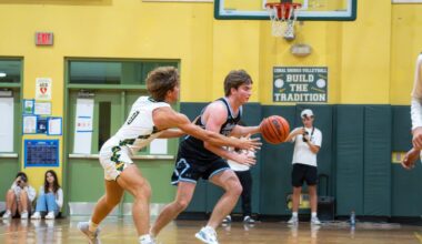 a group of young men playing a game of basketball