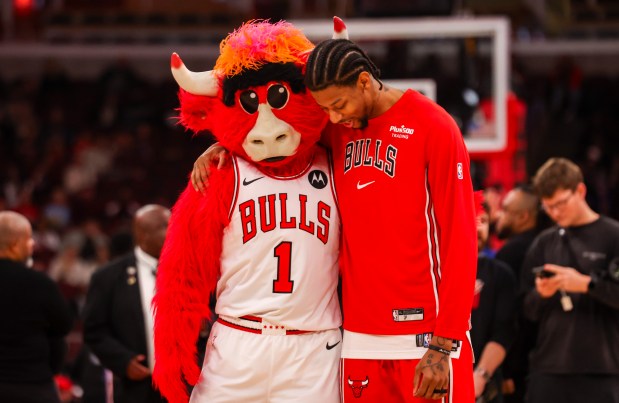 Chicago Bulls guard Dalen Terry hugs Benny the Bull during warmups on Friday, Dec. 26, 2025, at the United Center in Chicago. (Dominic Di Palermo/Chicago Tribune)
