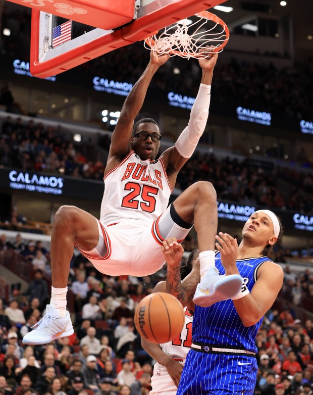 Bulls forward Jalen Smith dunks over Magic forward Paolo Banchero in the first quarter at the United Center on Jan. 2, 2026, in Chicago. (John J. Kim/Chicago Tribune)