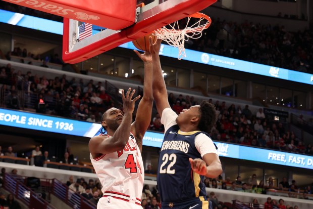 Bulls forward Patrick Williams (44) goes to the rim against Pelicans center Derik Queen (22) in the first half at the United Center on Wednesday, Dec. 31, 2025. (Terrence Antonio James/Chicago Tribune)