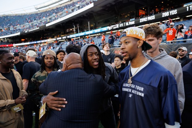 Bears President Kevin Warren hugs Bulls guard Ayo Dosunmu before the Bears-Vikings game Sept. 8, 2025, at Soldier Field. (Armando L. Sanchez/Chicago Tribune)