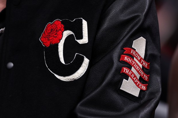 Chicago Bulls players wear custom-made jackets on the bench in honor of Derrick Rose in the first half of a game between the Bulls and the Boston Celtics at the United Center in Chicago on Jan. 24, 2026. The Bulls are retiring Rose's #1 jersey after the game. (Chris Sweda/Chicago Tribune)