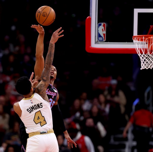 Chicago Bulls forward/guard Isaac Okoro (35) blocks the shot of Boston Celtics guard Anfernee Simons (4) in the first half of a game at the United Center in Chicago on Jan. 24, 2026. (Chris Sweda/Chicago Tribune)