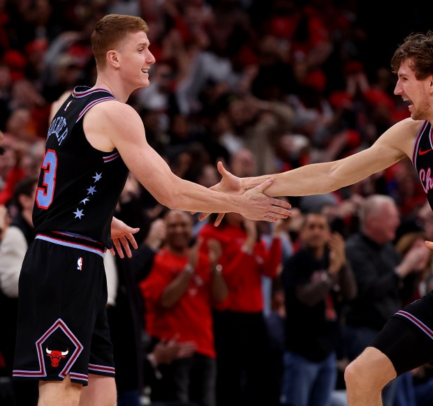 Chicago Bulls guard/forward Kevin Huerter (left) celebrates with teammate Matas Buzelis (right) after Huerter hit the game-winning 3-pointer against the Boston Celtics at the United Center in Chicago on Jan. 24, 2026. (Chris Sweda/Chicago Tribune)