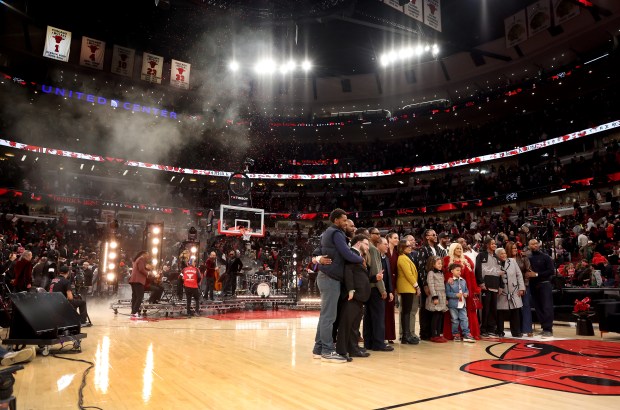 Derrick Rose poses with family and friends after his #1 jersey was retired by the Chicago Bulls at the United Center in Chicago on Jan. 24, 2026. (Chris Sweda/Chicago Tribune)