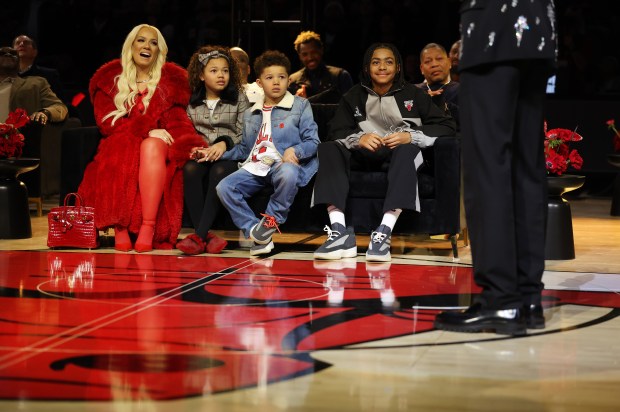 The family of Derrick Rose listen in as he gives a speech during a ceremony to retire his #1 jersey by the Chicago Bulls at the United Center in Chicago on Jan. 24, 2026. (Chris Sweda/Chicago Tribune)