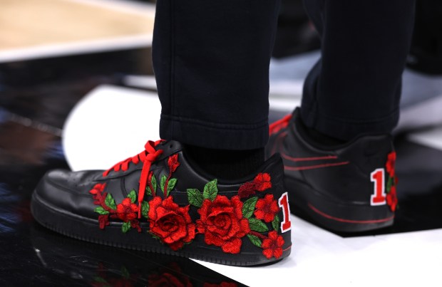 A Chicago Bulls player wears Derrick Rose themed shoes on the bench during a game between the Bulls and the Boston Celtics at the United Center in Chicago on Jan. 24, 2026. Following the game the Bulls held a ceremony to retire his #1 jersey. (Chris Sweda/Chicago Tribune)