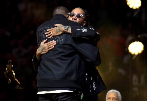Luol Deng and Derrick Rose embrace after Deng gave a speech honoring Rose as the Bulls held a ceremony to retire Rose's #1 jersey at the United Center in Chicago on Jan. 24, 2026. (Chris Sweda/Chicago Tribune)