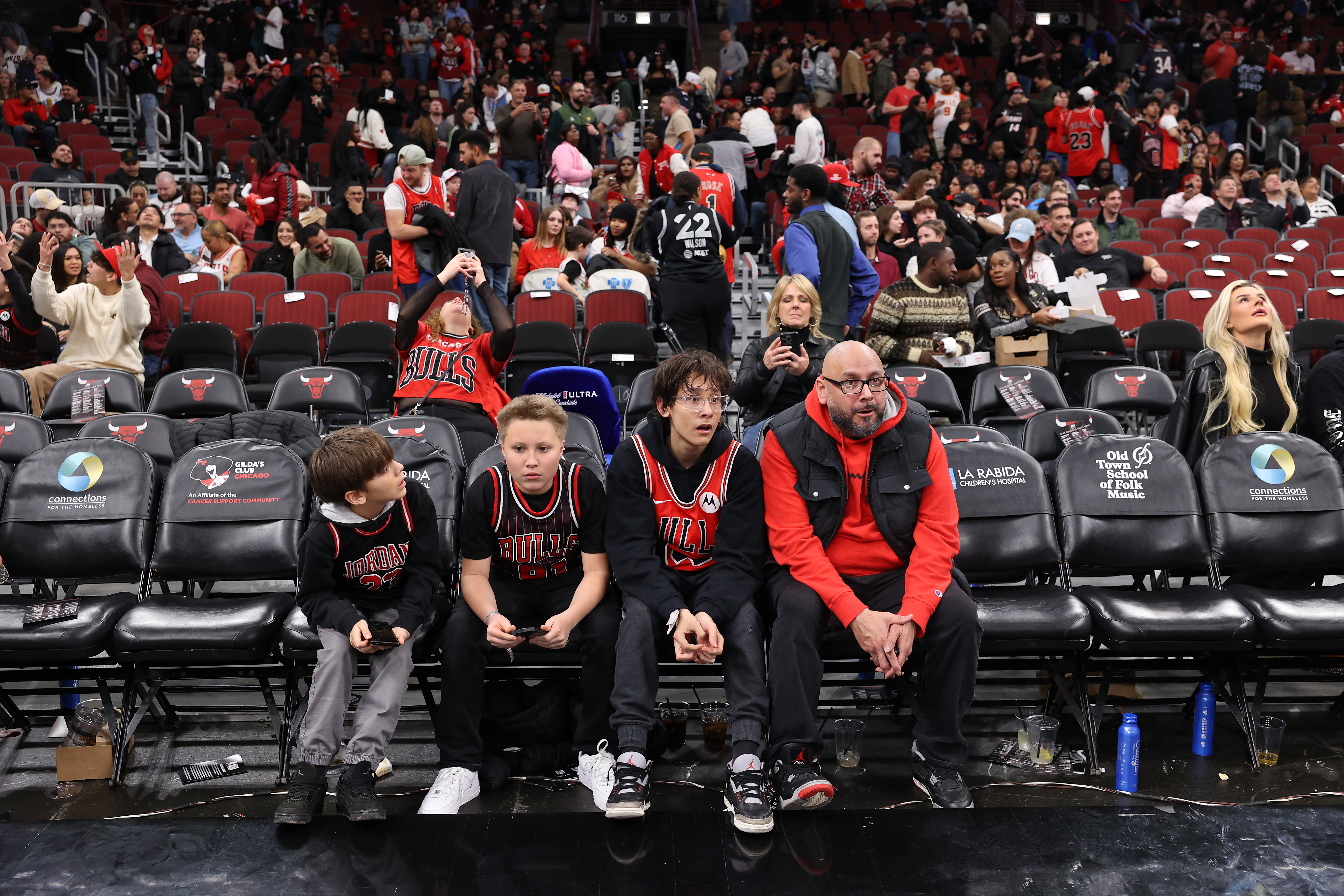 Chicago Bulls fans react as it is announced that the...