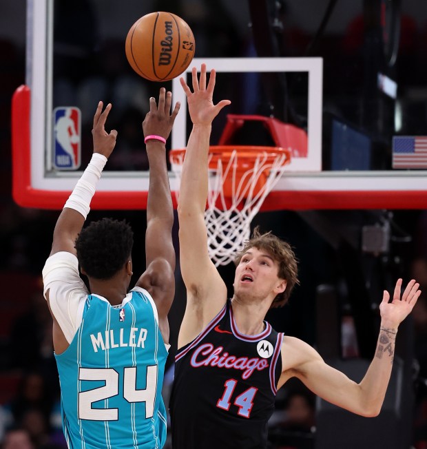 Charlotte Hornets forward Brandon Miller (24) shoots over Chicago Bulls forward Matas Buzelis (14) in the second half of a game at the United Center in Chicago on Jan. 3, 2026. (Chris Sweda/Chicago Tribune)