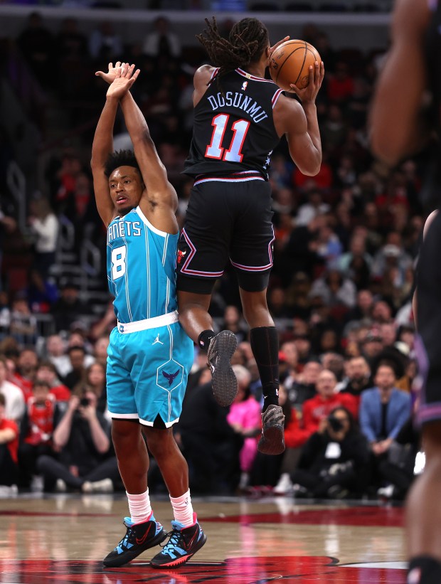 Chicago Bulls guard Ayo Dosunmu (11) hits a shot at the buzzer to end the first quarter of a game against the Charlotte Hornets at the United Center in Chicago on Jan. 3, 2026. (Chris Sweda/Chicago Tribune)