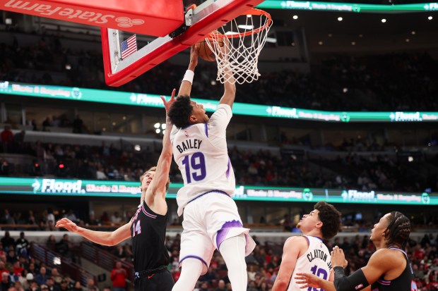 Utah Jazz guard Ace Bailey (19) dunks the ball near Chicago Bulls forward Matas Buzelis (14) during the second quarter at the United Center Jan. 14, 2026 in Chicago. (Armando L. Sanchez/Chicago Tribune)
