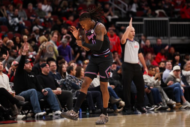 Chicago Bulls guard Ayo Dosunmu (11) celebrates after making a three-point shot during the second quarter against the Utah Jazz at the United Center Jan. 14, 2026 in Chicago. (Armando L. Sanchez/Chicago Tribune)