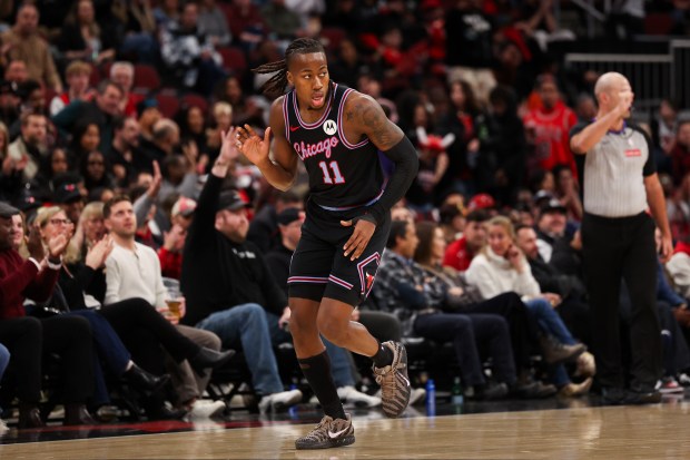 Chicago Bulls guard Ayo Dosunmu (11) celebrates after making a three-point shot during the second quarter against the Utah Jazz at the United Center Jan. 14, 2026 in Chicago. (Armando L. Sanchez/Chicago Tribune)