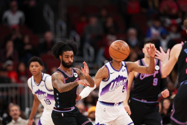 Chicago Bulls guard Coby White (0) passes the ball during the first quarter against the Utah Jazz at the United Center Jan. 14, 2026 in Chicago. (Armando L. Sanchez/Chicago Tribune)