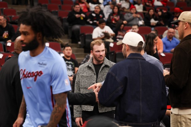 Cubs outfielder Ian Happ walks around the court before the Chicago Bulls play the Utah Jazz at the United Center Jan. 14, 2026 in Chicago. (Armando L. Sanchez/Chicago Tribune)