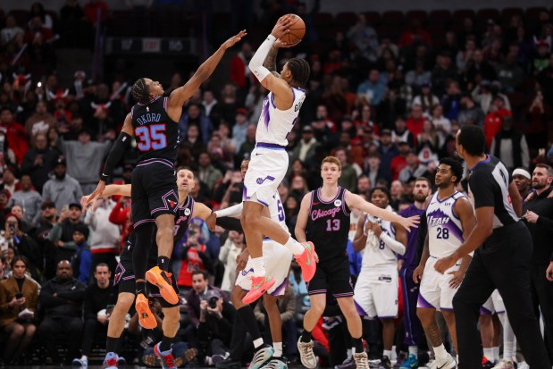 Chicago Bulls forward Isaac Okoro (35) guards Utah Jazz guard Keyonte George (3) as he tries to make the final shot of the game before the Bulls would go to defeat the Jazz, 128-126, at the United Center Jan. 14, 2026 in Chicago. (Armando L. Sanchez/Chicago Tribune)