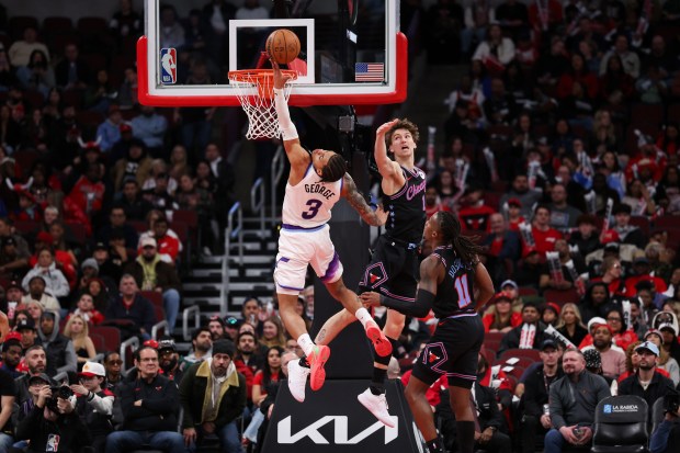 Chicago Bulls forward Matas Buzelis (14) guards Utah Jazz guard Keyonte George (3) during the third quarter at the United Center Jan. 14, 2026 in Chicago. (Armando L. Sanchez/Chicago Tribune)