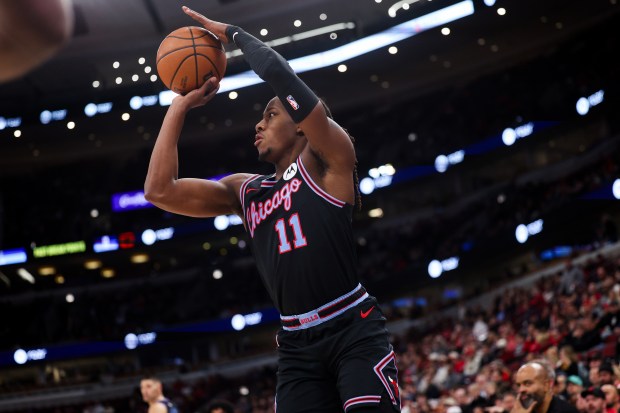Chicago Bulls guard Ayo Dosunmu (11) looks before taking a shot during the third quarter against the Utah Jazz at the United Center Jan. 14, 2026 in Chicago. (Armando L. Sanchez/Chicago Tribune)