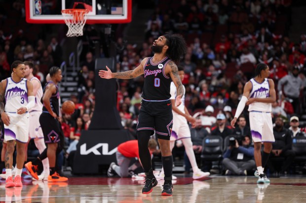 Chicago Bulls guard Coby White (0) looks up at the scoreboard after being given a foul during the fourth quarter against the Utah Jazz at the United Center Jan. 14, 2026 in Chicago. (Armando L. Sanchez/Chicago Tribune)