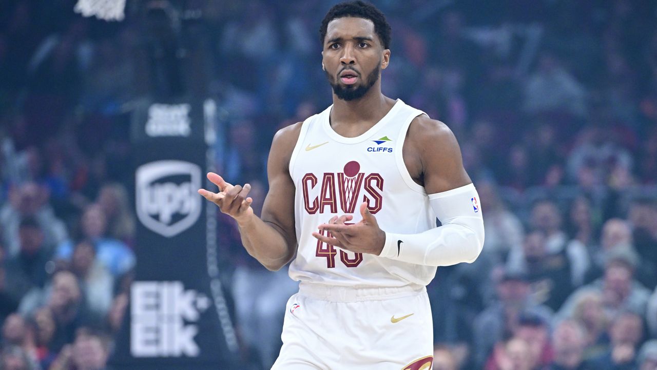 Cleveland Cavaliers guard Donovan Mitchell celebrates after making a three-point basket in the first half of an NBA basketball game against the Sacramento Kings, Friday, Jan. 23, 2026, in Cleveland.