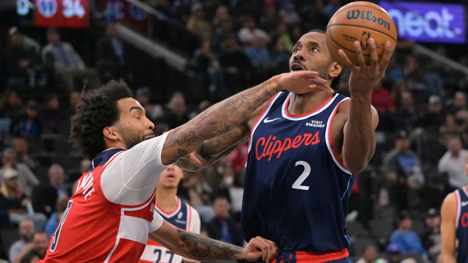Clippers forward Kawhi Leonard (2) is fouled by Washington Wizards forward Justin Champagnie (9) in the first half at Intuit Dome