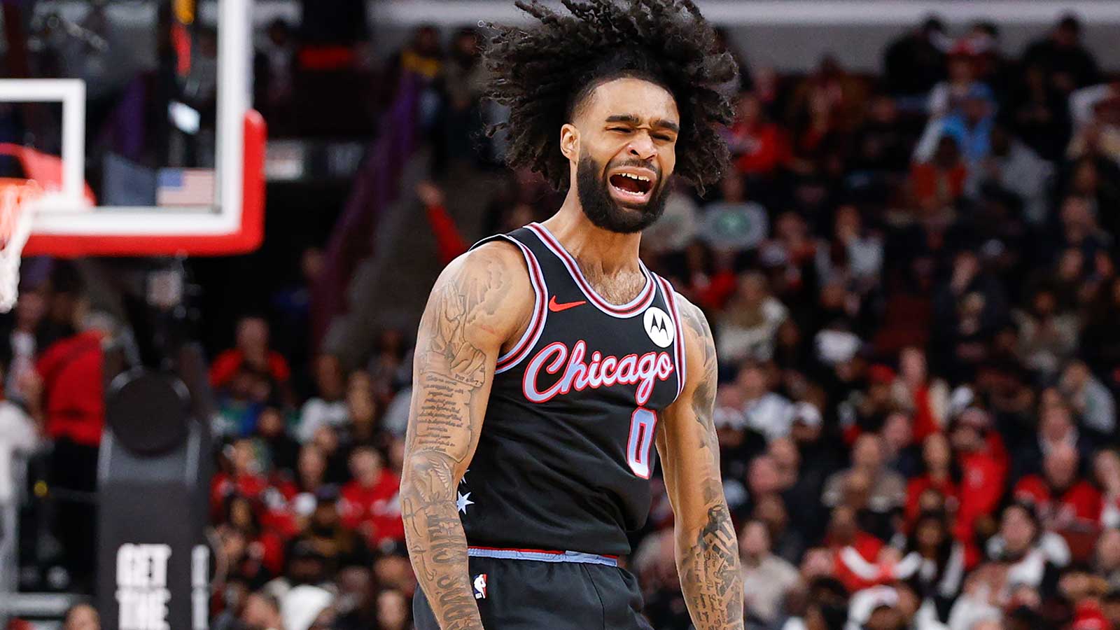 Chicago Bulls guard Coby White (0) reacts after scoring against the Boston Celtics during the first half at United Center. 