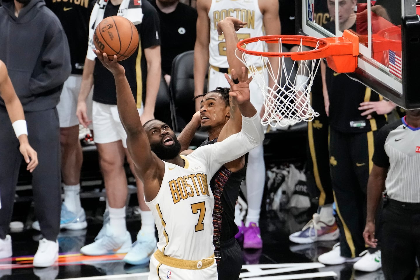 Jaylen Brown (left) goes up for a shot while being guarded by Nets center Nic Claxton on Friday night.
