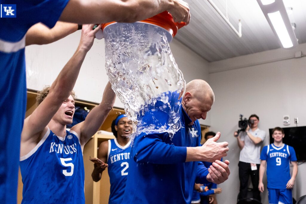 Kentucky players dump water on Mark Pope after beating Tennessee - Photo by UK Athletics