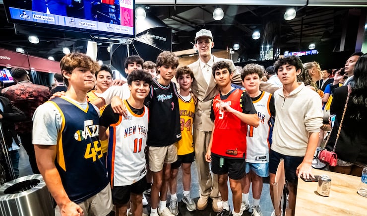 Egor Demin poses with young fans at the NBA draft Wednesday, June 25, 2025, in Brooklyn, New York.