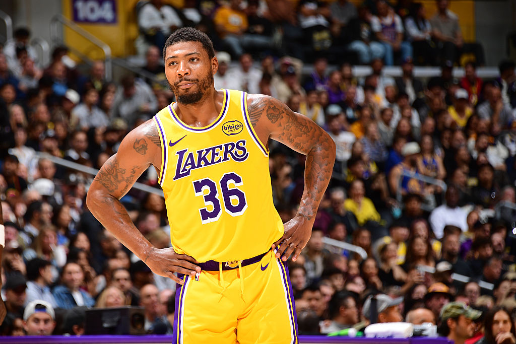 LOS ANGELES, CA - OCTOBER 21: Marcus Smart #36 of the Los Angeles Lakers smiles during the game against the Golden State Warriors on October 21, 2025 at Crypto.Com Arena in Los Angeles, California. NOTE TO USER: User expressly acknowledges and agrees that, by downloading and/or using this Photograph, user is consenting to the terms and conditions of the Getty Images License Agreement. Mandatory Copyright Notice: Copyright 2025 NBAE (Photo by Adam Pantozzi/NBAE via Getty Images)