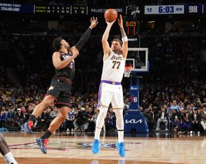 PHILADELPHIA, PA - DECEMBER 7: Luka Doncic #77 of the Los Angeles Lakers shoots a three point basket during the game against the Philadelphia 76ers on December 7, 2025 at the Wells Fargo Center in Philadelphia, Pennsylvania