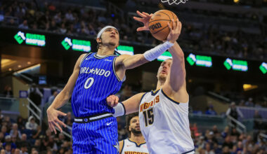 ORLANDO, FL - DECEMBER 27: Anthony Black #0 of the Orlando Magic drives against Nikola Jokic #15 of the Denver Nuggets in the first half of the game at Kia Center on December 27, 2025 in Orlando, Florida.
