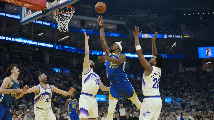 Jimmy Butler III #10 of the Golden State Warriors shoots over Svi Mykhailiuk #10 of the Utah Jazz...