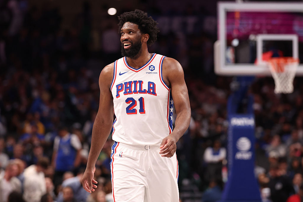 DALLAS, TEXAS - JANUARY 01: Joel Embiid #21 of the Philadelphia 76ers looks on during the second half against the Dallas Mavericks at American Airlines Center on January 01, 2026 in Dallas, Texas. NOTE TO USER: User expressly acknowledges and agrees that, by downloading and or using this photograph, user is consenting to the terms and conditions of the Getty Images License Agreement. (Photo by Sam Hodde/Getty Images)