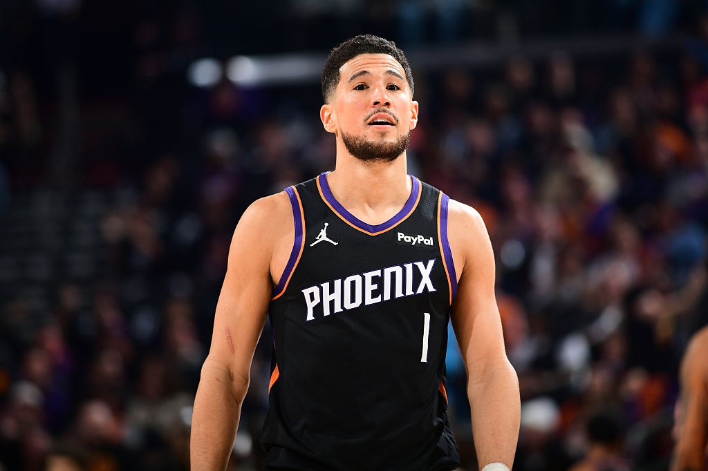 PHOENIX, AZ - JANUARY 11: Devin Booker #1 of the Phoenix Suns smiles during the game against the Washington Wizards on January 11, 2026 at PHX Arena in Phoenix, Arizona. NOTE TO USER: User expressly acknowledges and agrees that, by downloading and or using this photograph, user is consenting to the terms and conditions of the Getty Images License Agreement. Mandatory Copyright Notice: Copyright 2026 NBAE (Photo by Kate Frese/NBAE via Getty Images)