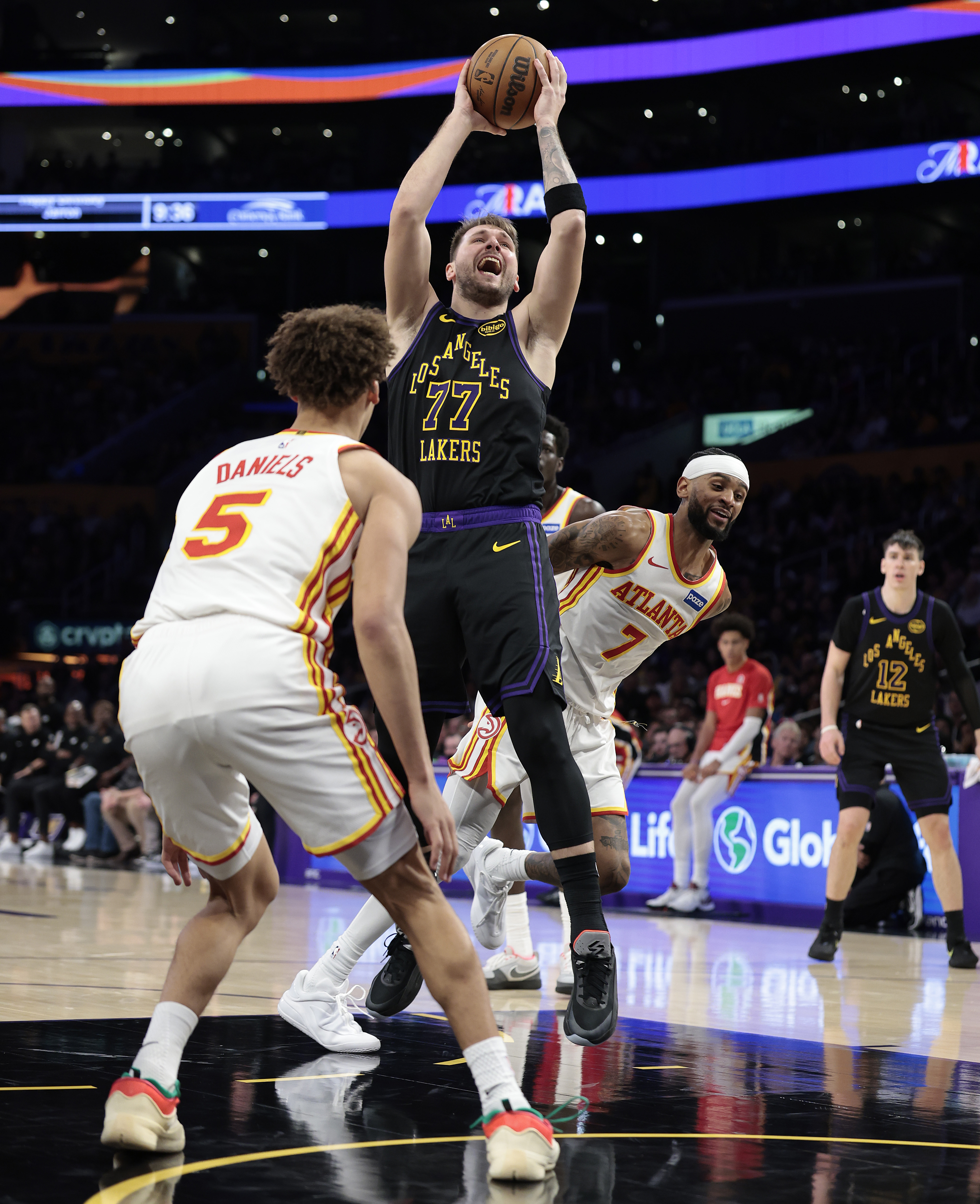 Lakers star Luka Doncic takes a shot as the Atlanta...