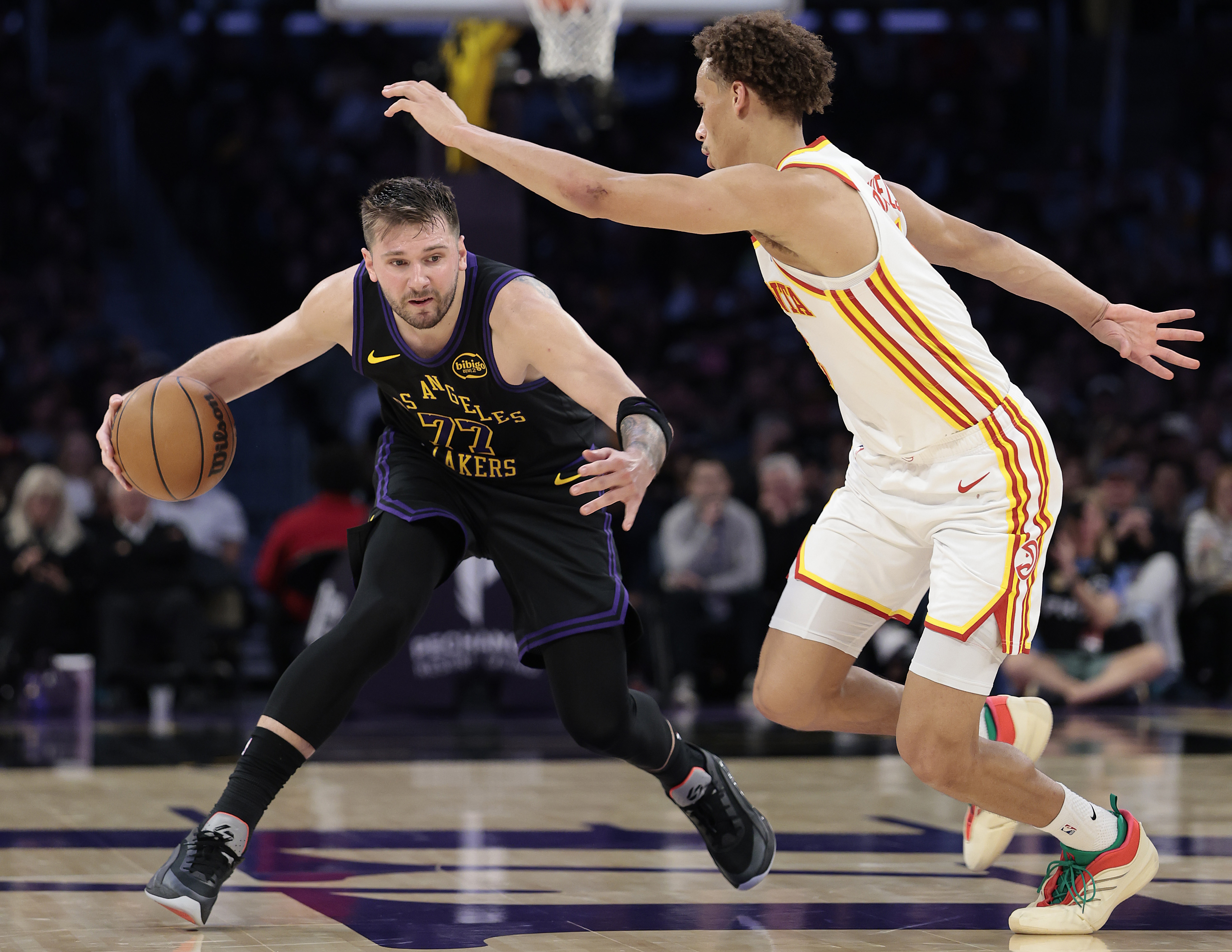 Lakers star Luka Doncic handles the ball as the Atlanta...