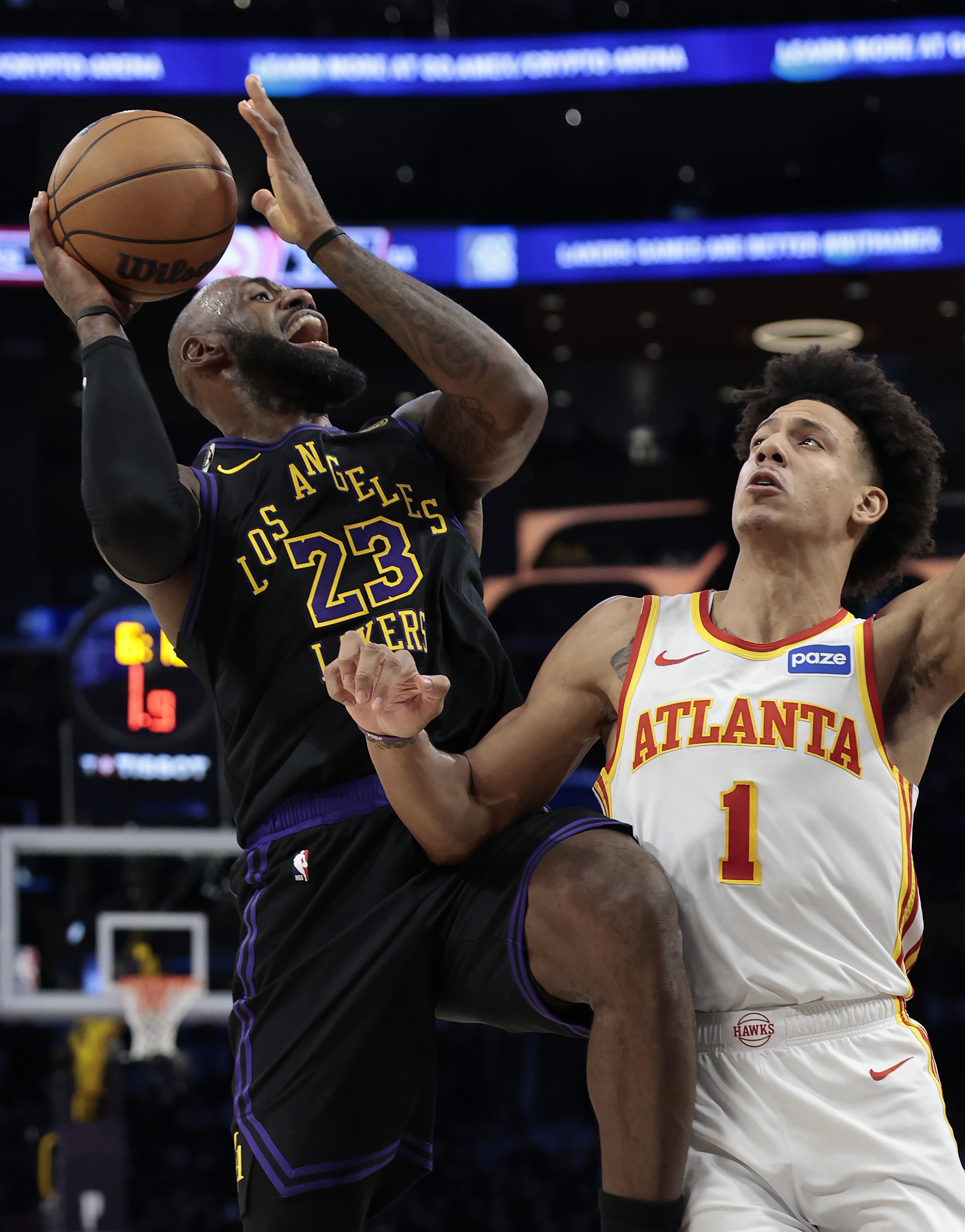 Lakers star LeBron James takes a shot as the Atlanta...