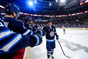 WINNIPEG, CANADA - JANUARY 17: Mark Scheifele #55 of the Winnipeg Jets celebrates a second period goal against the Toronto Maple Leafs with teammates at the bench at the Canada Life Centre on January 17, 2026 in Winnipeg, Manitoba, Canada. (Photo by Jonathan Kozub/NHLI via Getty Images)