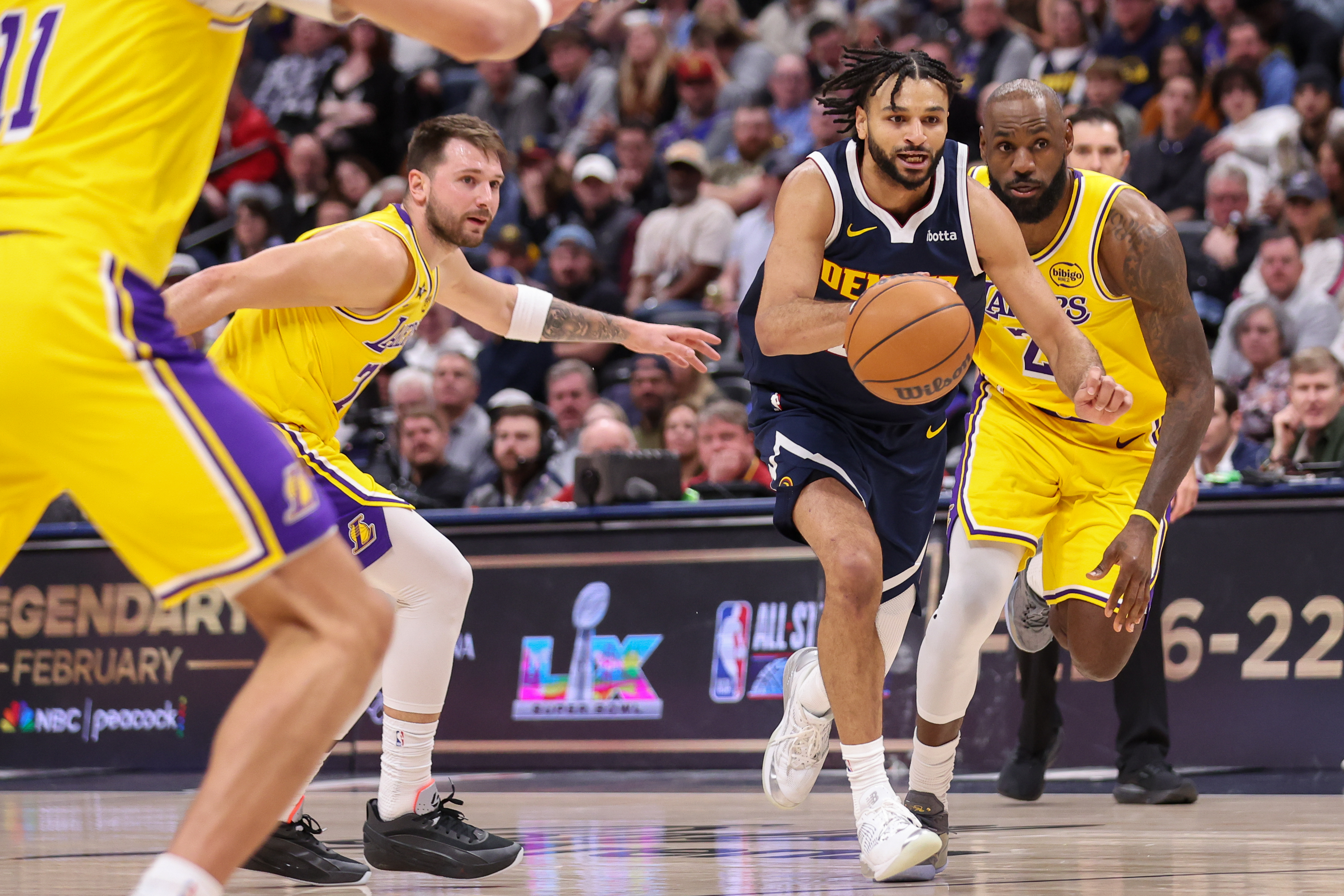 Denver Nuggets guard Jamal Murray drives to the basket as...